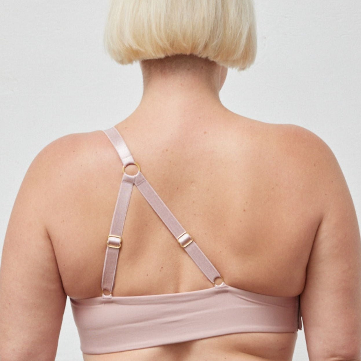 Rachel Right Unilateral Molded Cup Sling Bra in Blush | A molded cup bra with a side closure and intricate strap design on the back, providing stability and contours your curves for a snug and secure fit | By AnaOno